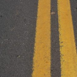 Diagonal lines on the pavement warn drivers of