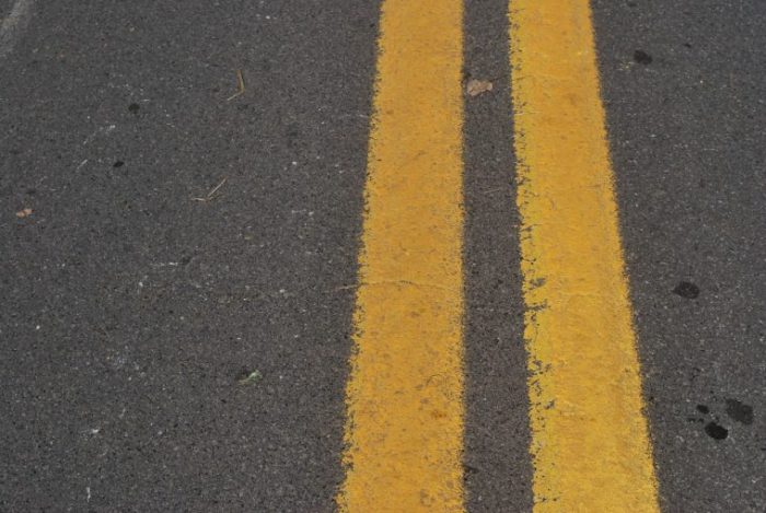 Diagonal lines on the pavement warn drivers of